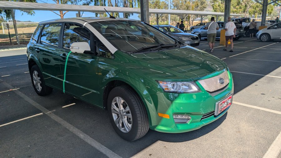 Attendees interacting with electric vehicles at La Trobe University Wodonga